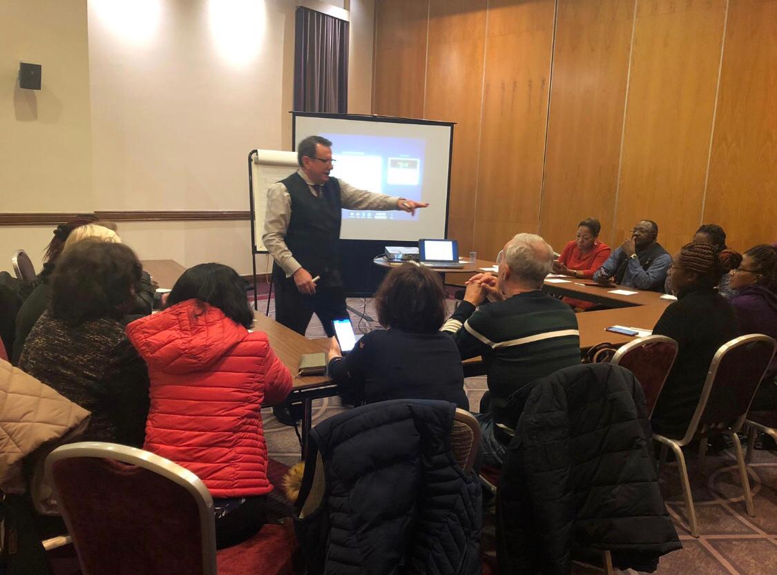 Ivan explaining a chart during a classroom session